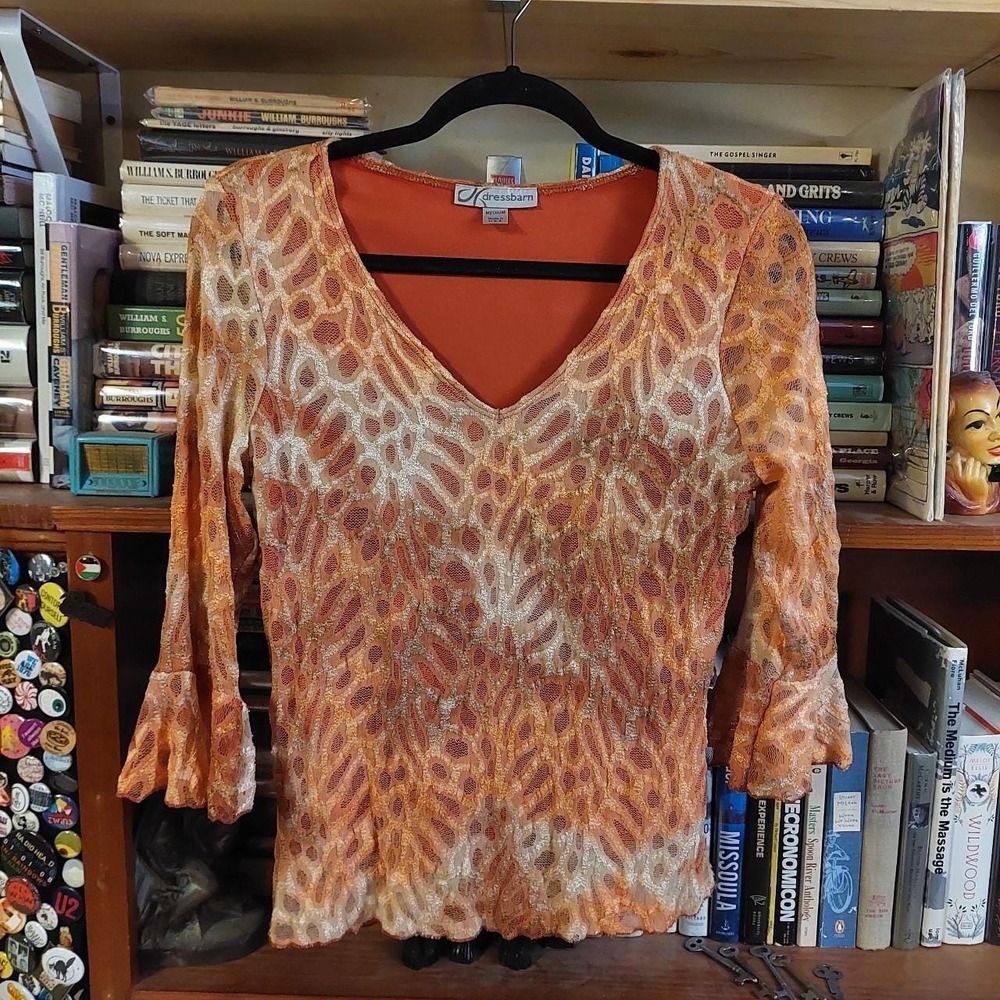 Y2K orange and cream 3/4 sleeve blouse with ruffle sleeves and v-neck.